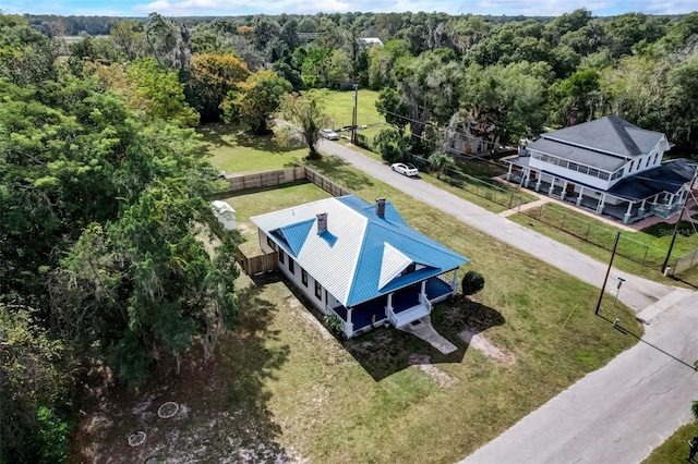 birds eye view of property with a forest view