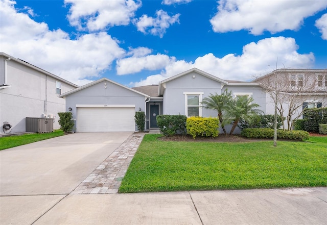 ranch-style home with central air condition unit, stucco siding, a front yard, a garage, and driveway