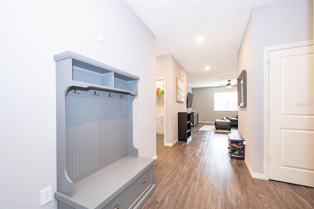 mudroom featuring ceiling fan, wood finished floors, and baseboards