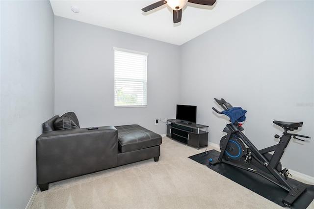 interior space with a ceiling fan and baseboards