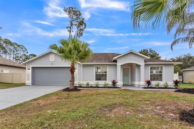 single story home with driveway, an attached garage, fence, a front lawn, and stucco siding