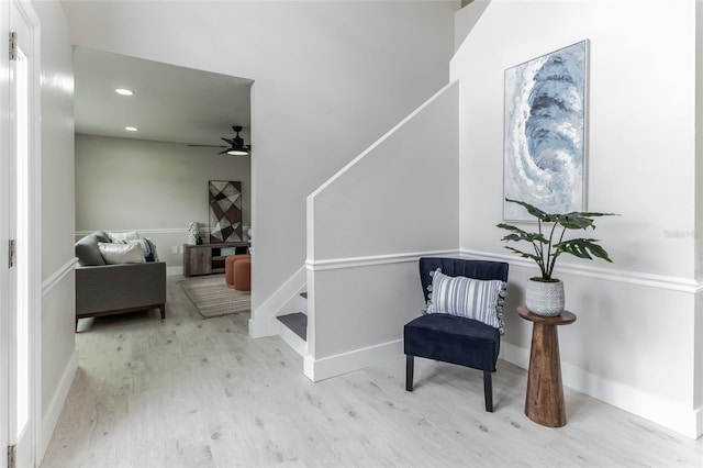 living area with a ceiling fan, light wood-type flooring, baseboards, and recessed lighting