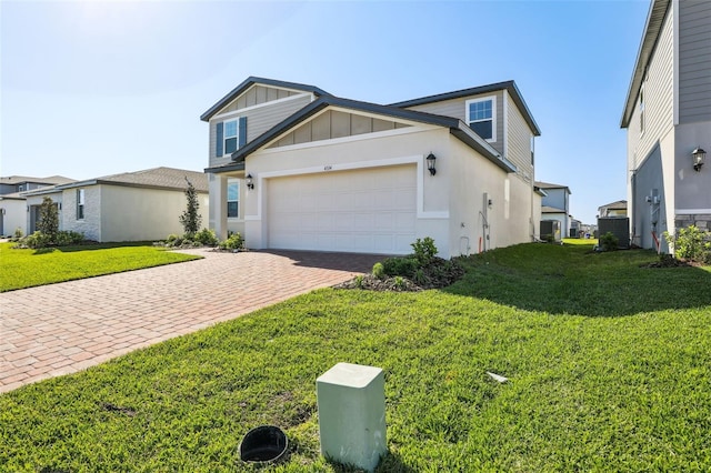 view of front of property with a garage, board and batten siding, a front yard, and decorative driveway