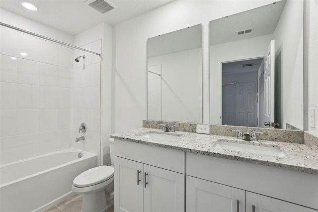 full bathroom with a sink, visible vents, and toilet