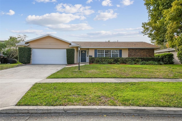 ranch-style home featuring a garage, concrete driveway, stucco siding, a front yard, and brick siding