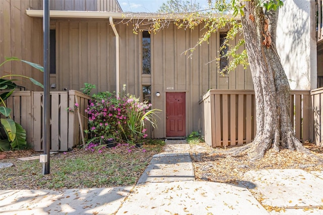 doorway to property with fence