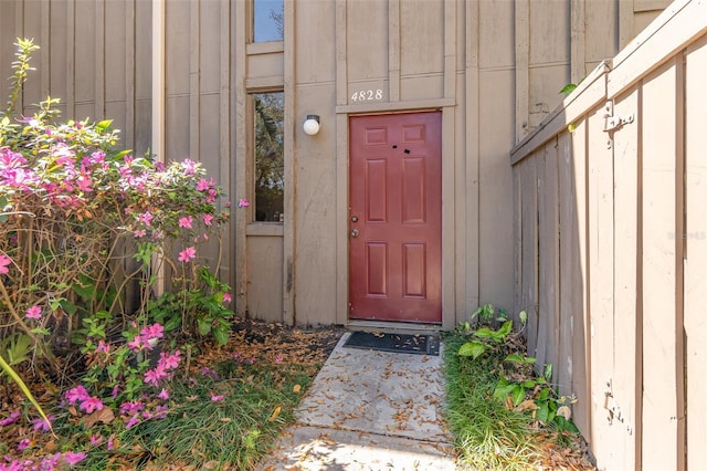 view of exterior entry with board and batten siding