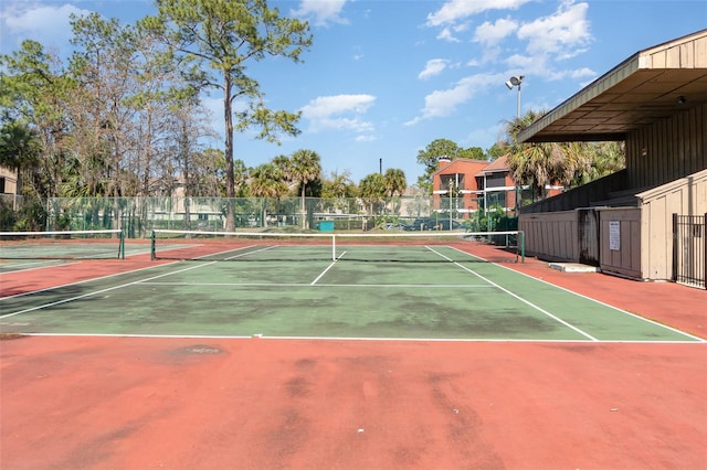 view of sport court featuring fence