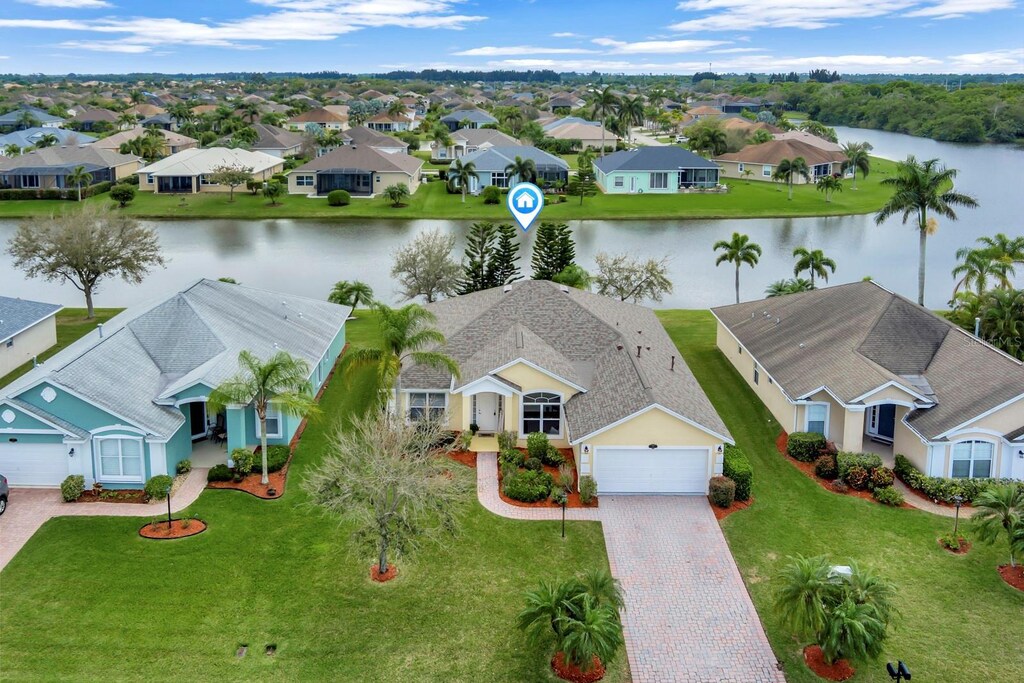 517 S Valencia Cir SW, Vero Beach, FL 32968 - drone / aerial view featuring a residential view and a water view