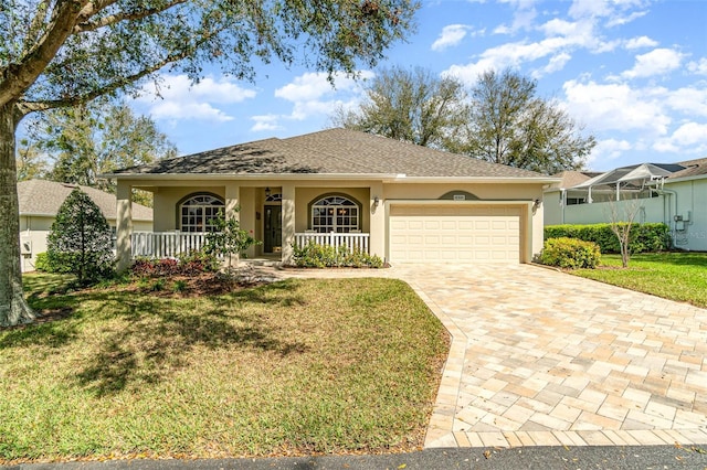 single story home with an attached garage, a front lawn, decorative driveway, and stucco siding