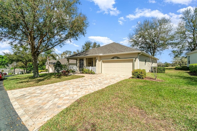 ranch-style house with driveway, an attached garage, covered porch, a front yard, and stucco siding