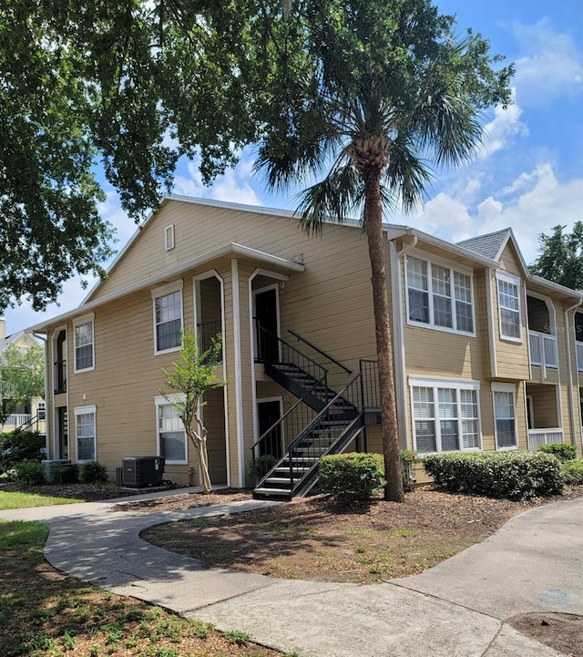 multi unit property featuring central AC and stairs