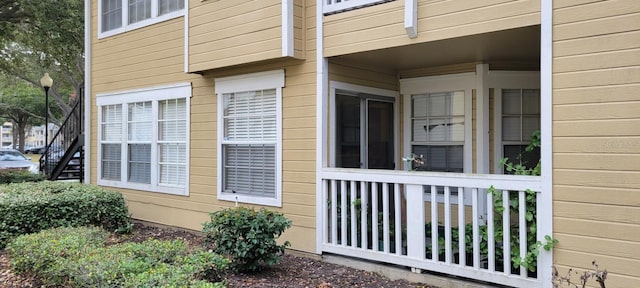 view of side of property with stairs