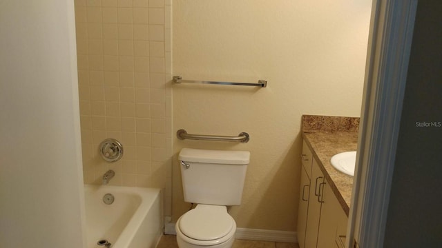 bathroom featuring toilet, shower / bathing tub combination, vanity, and baseboards