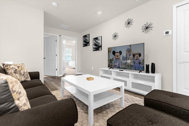 living room with wood finished floors