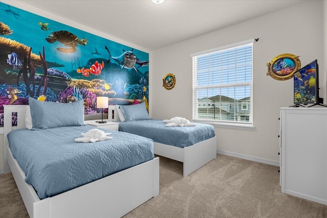 bedroom featuring carpet and baseboards