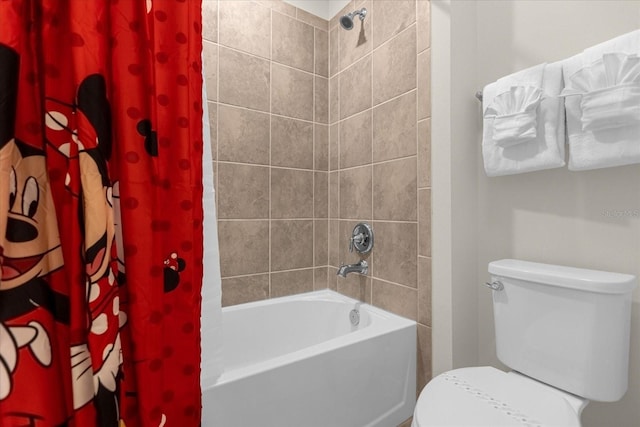 bathroom with shower / bath combination with curtain and toilet