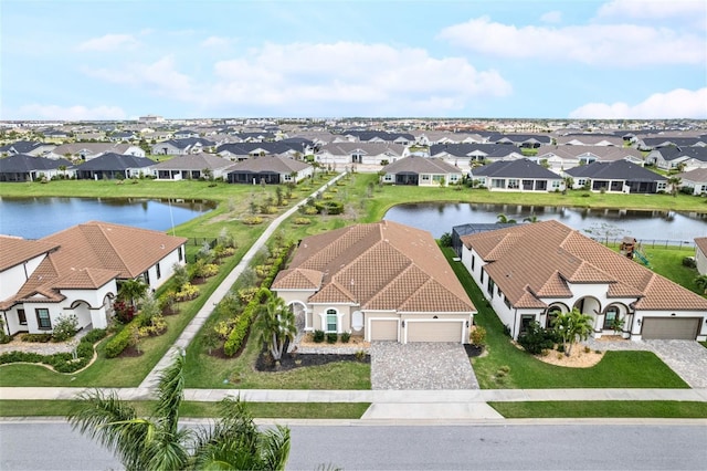 aerial view with a residential view and a water view