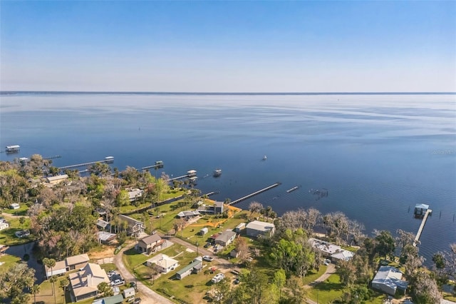 bird's eye view featuring a water view and a residential view