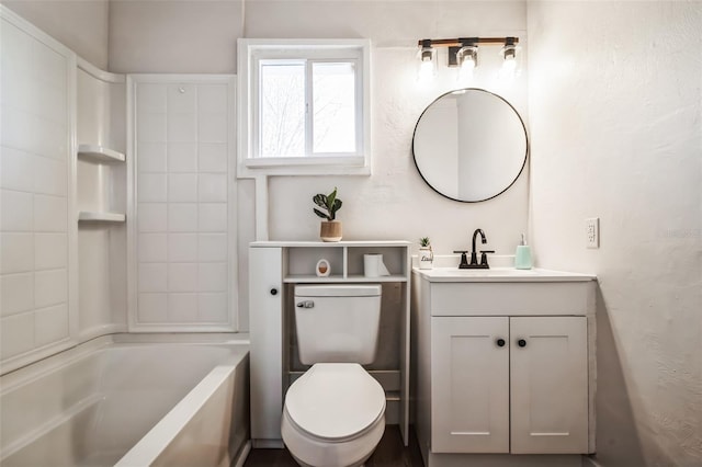 bathroom with bathing tub / shower combination, vanity, and toilet