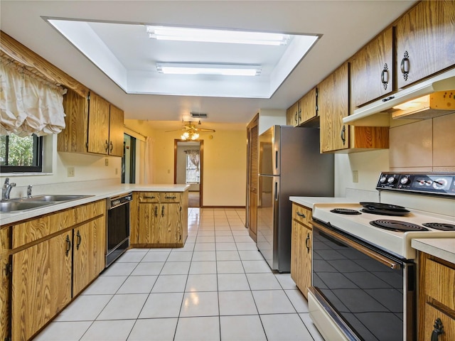 kitchen with light tile patterned floors, dishwasher, electric stove, a peninsula, and under cabinet range hood