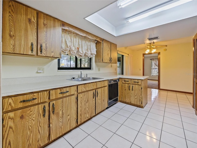 kitchen with light tile patterned floors, light countertops, a sink, dishwasher, and a peninsula