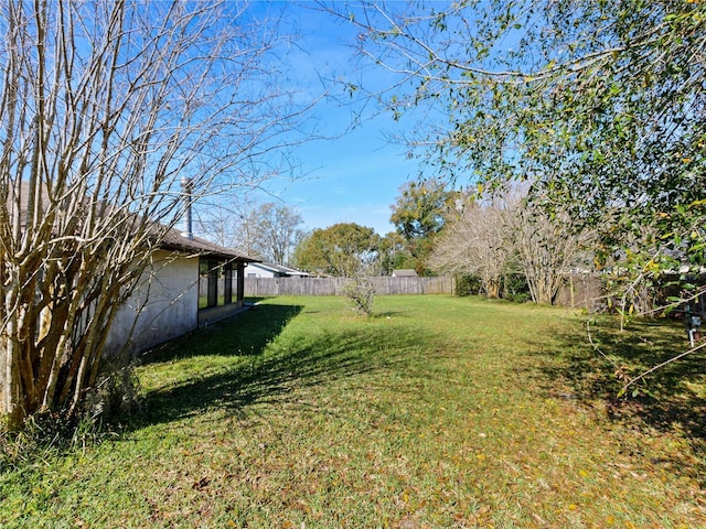 view of yard featuring a fenced backyard