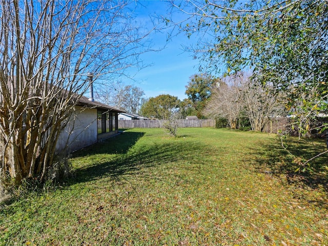 view of yard featuring a fenced backyard