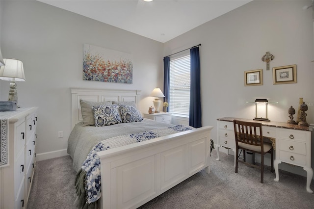 bedroom with light carpet and baseboards