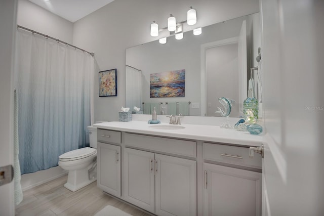 full bathroom with toilet, a shower with curtain, and vanity