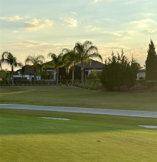 view of property's community with a lawn