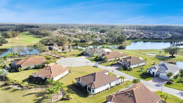 birds eye view of property with a residential view, a water view, and golf course view