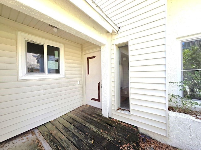 entrance to property featuring a deck