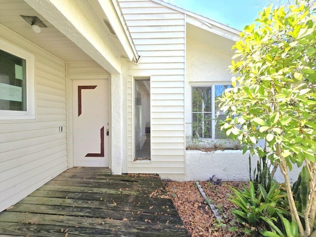 doorway to property with a wooden deck