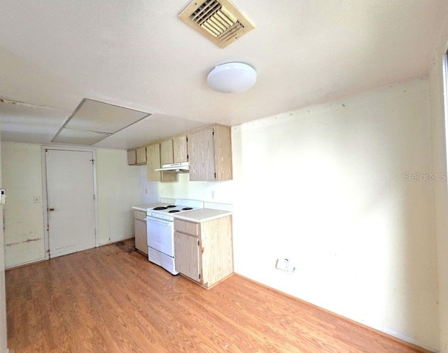 kitchen featuring white electric stove, light countertops, visible vents, and light wood-style floors