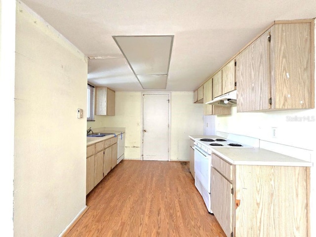 kitchen featuring light countertops, white appliances, light brown cabinetry, and under cabinet range hood