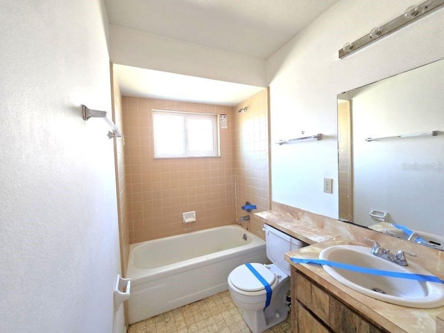 full bath with shower / bathtub combination, toilet, vanity, and tile patterned floors