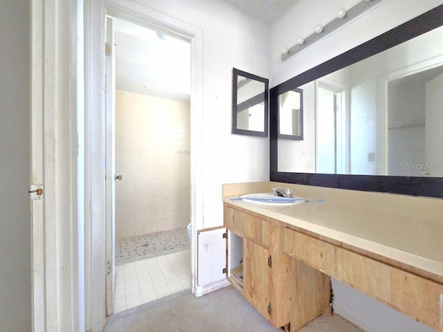 full bath with a shower stall and vanity