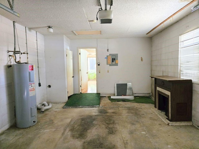 garage featuring electric panel, a garage door opener, and electric water heater