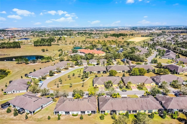 aerial view featuring a residential view and a water view