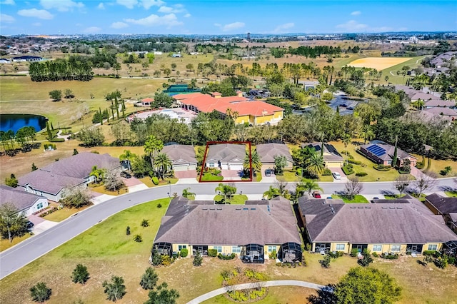 bird's eye view with a water view and a residential view