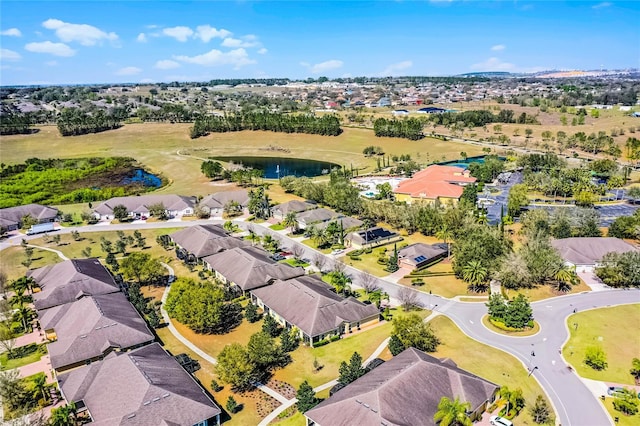 bird's eye view with a water view and a residential view