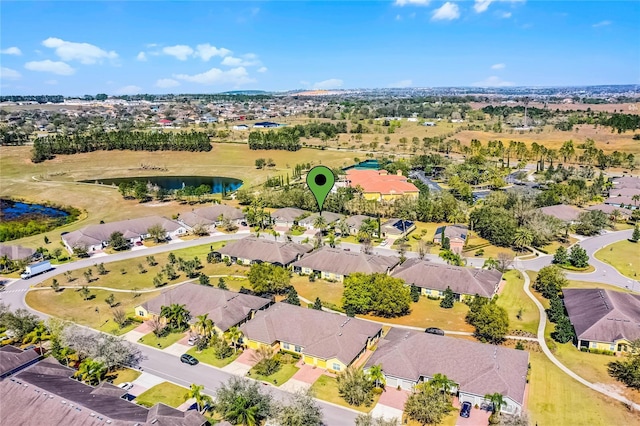 bird's eye view featuring a water view and a residential view