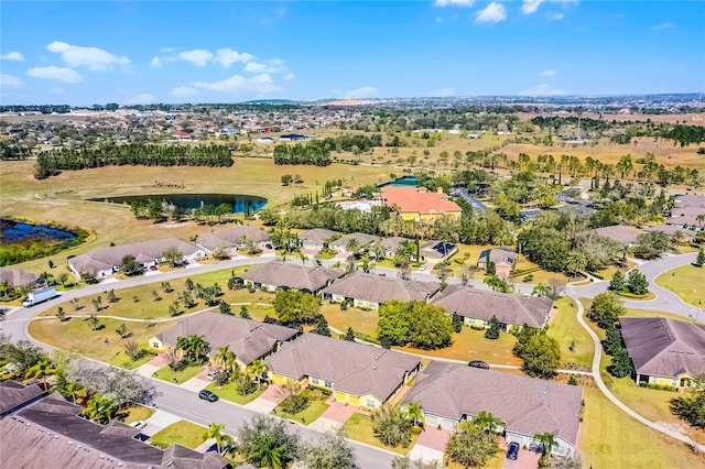 bird's eye view with a water view and a residential view