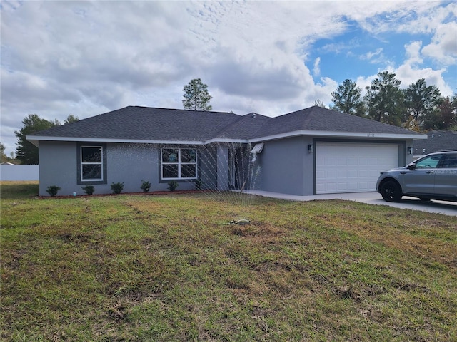 single story home with a front lawn, an attached garage, a shingled roof, and stucco siding