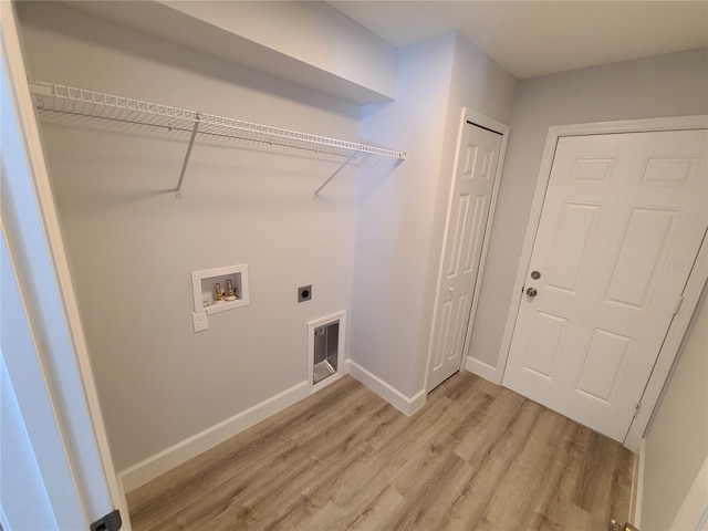 laundry room with laundry area, washer hookup, baseboards, light wood finished floors, and electric dryer hookup