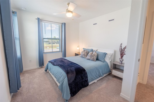 bedroom with carpet, visible vents, ceiling fan, and baseboards