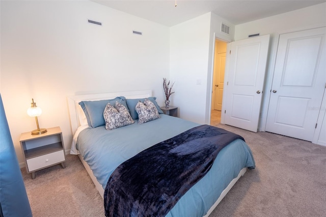 carpeted bedroom with visible vents