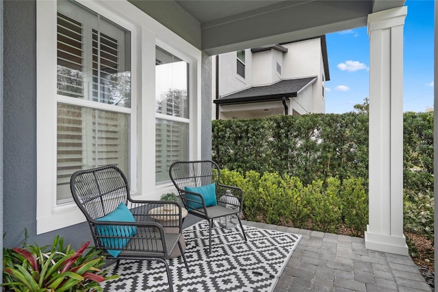 view of patio featuring a porch