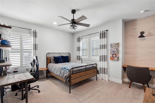 bedroom with recessed lighting, light carpet, ceiling fan, a textured ceiling, and baseboards